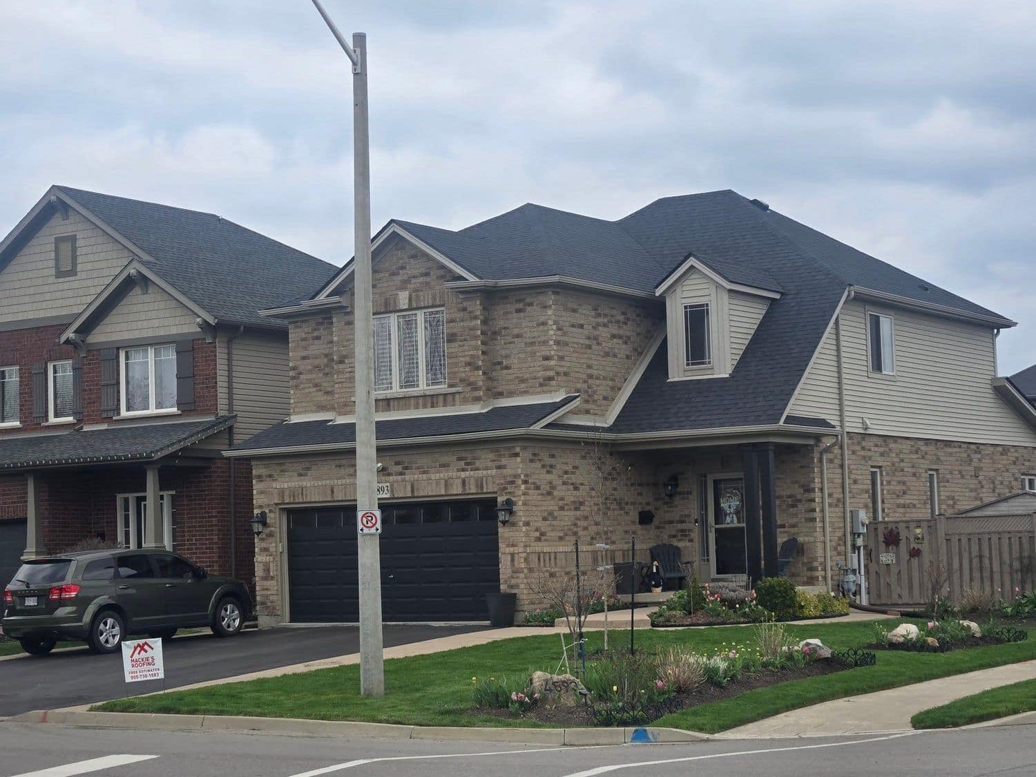 Stone and brick home with a new roof and attached garage